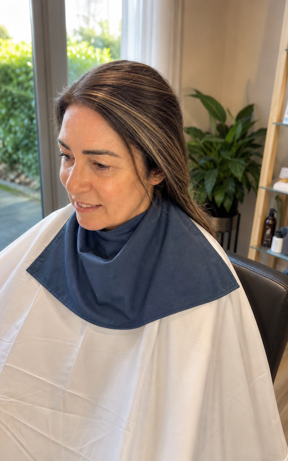 Soft grey blending hair service in a polished salon setting